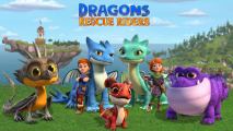 A boy and a girl standing on a green field with group of friendly dragons.